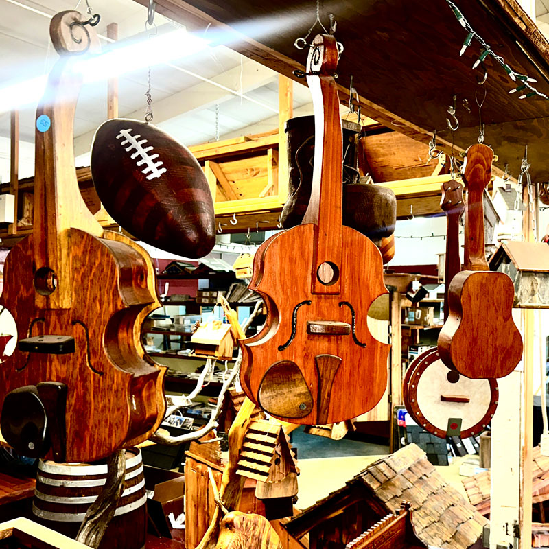 photo of the interior of the wood shop at Knox Garden Box with hanging wooden instruments and a football